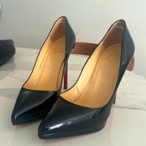 Christian Louboutin point toe red bottom heels